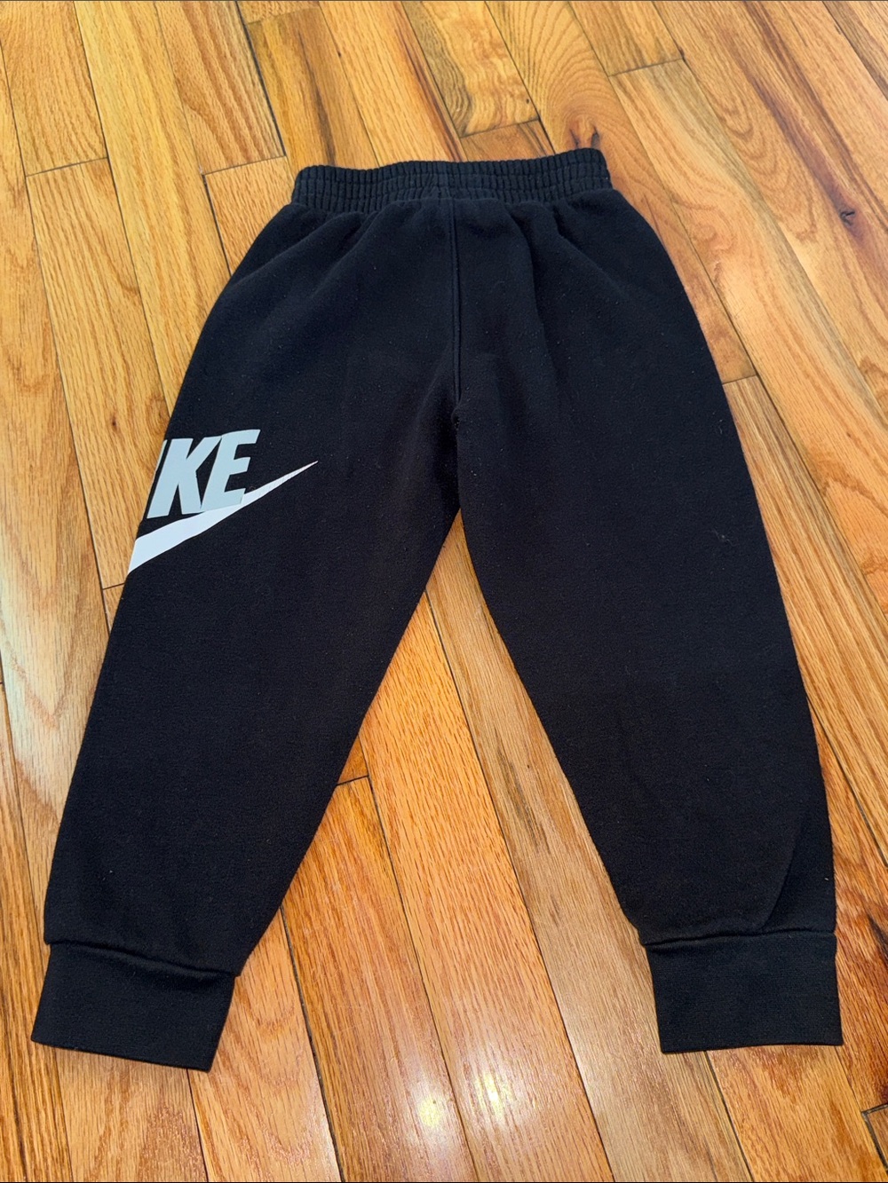 Nike Black Jogger Sweatpants with White Swoosh Graphic